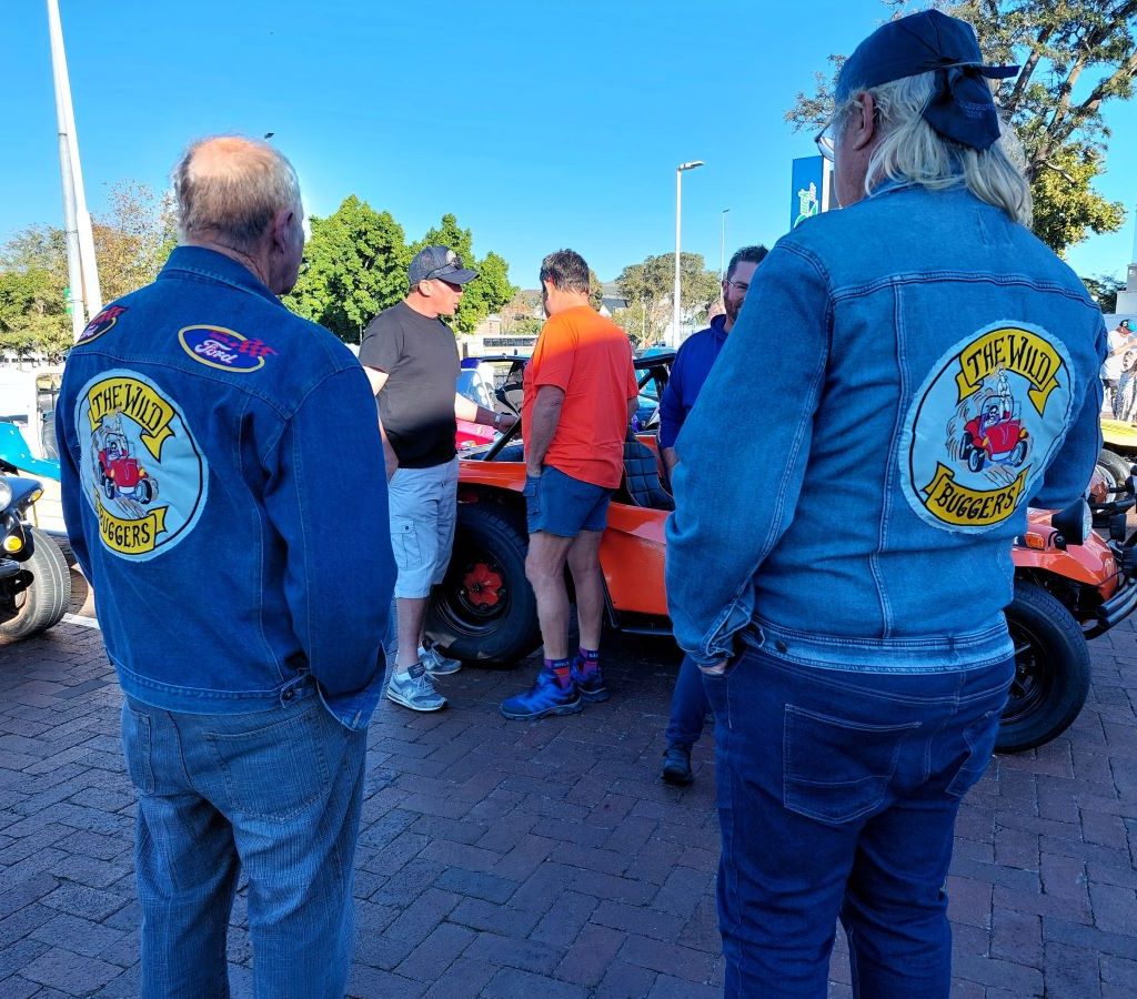 Wild Buggers Beach Buggy Club members socializing and chatting at the Durbanville meeting point before the Huis Uitsig Charity Run.