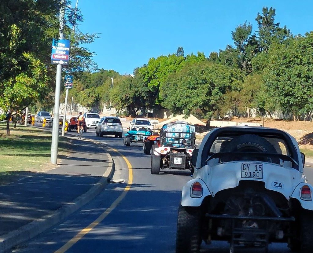 Convoy of classic Beach Buggies and VW air-cooled vehicles following the lead car on the road to the Huis Uitsig Charity event.