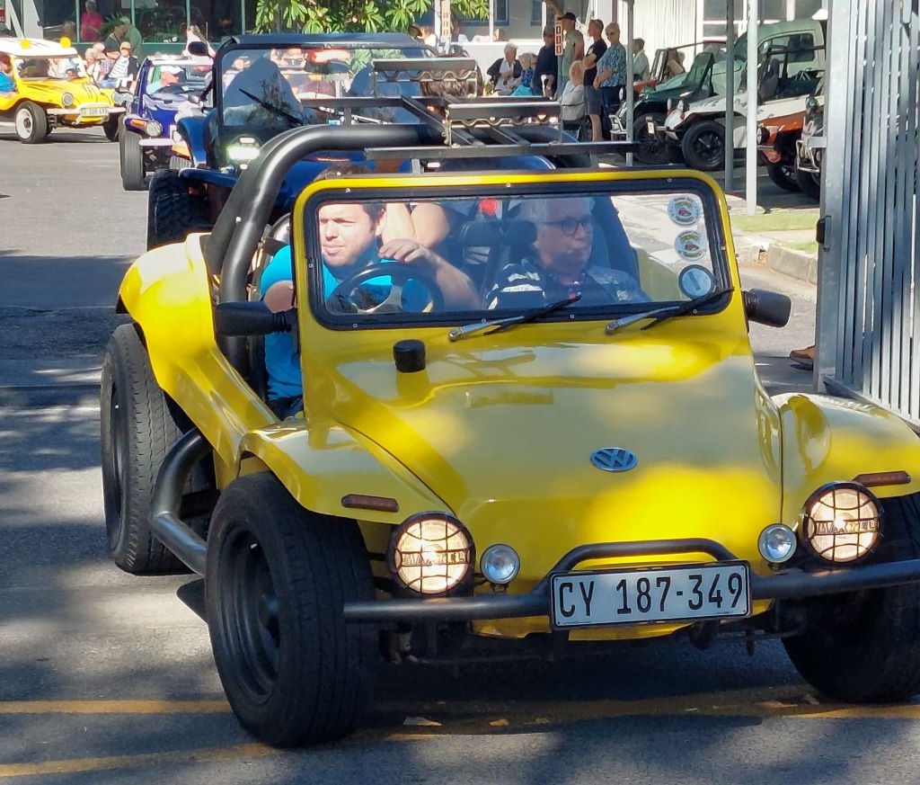 Cody taking a senior resident for a ride in his custom VW beach buggy during The Wild Buggers charity visit to Huis Uitsig.