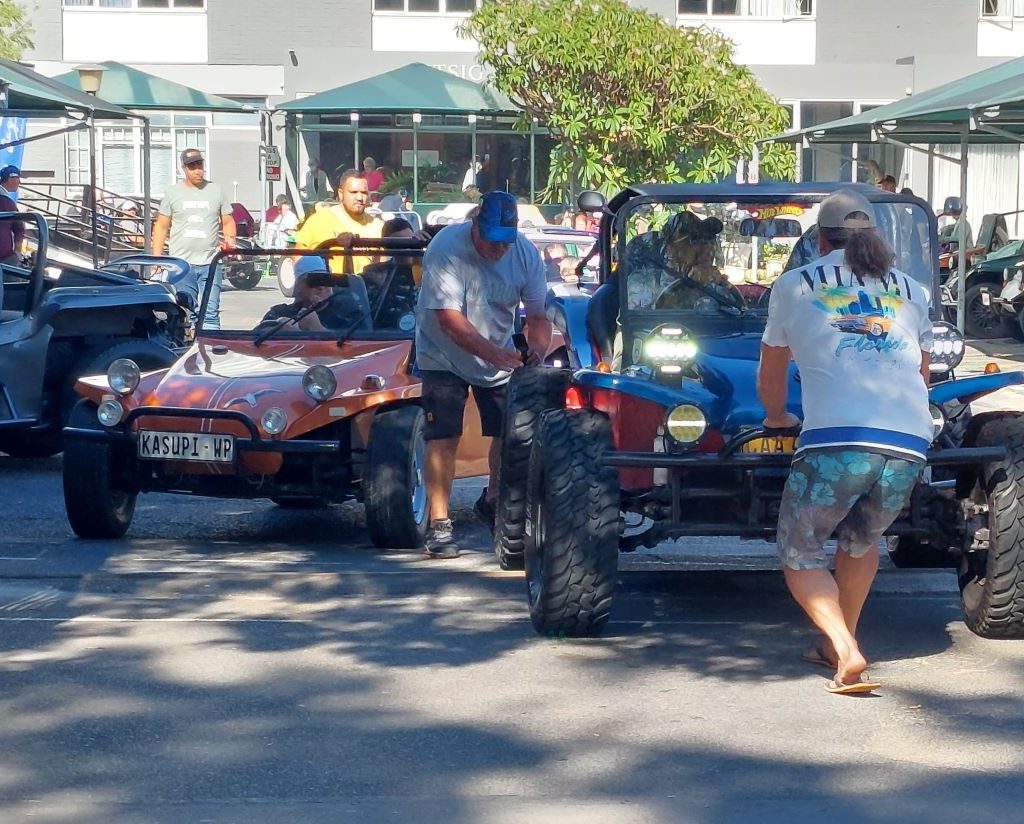 Senior residents from Huis Uitsig enjoying a ride in a Wild Buggers Beach Buggy Club vehicle.