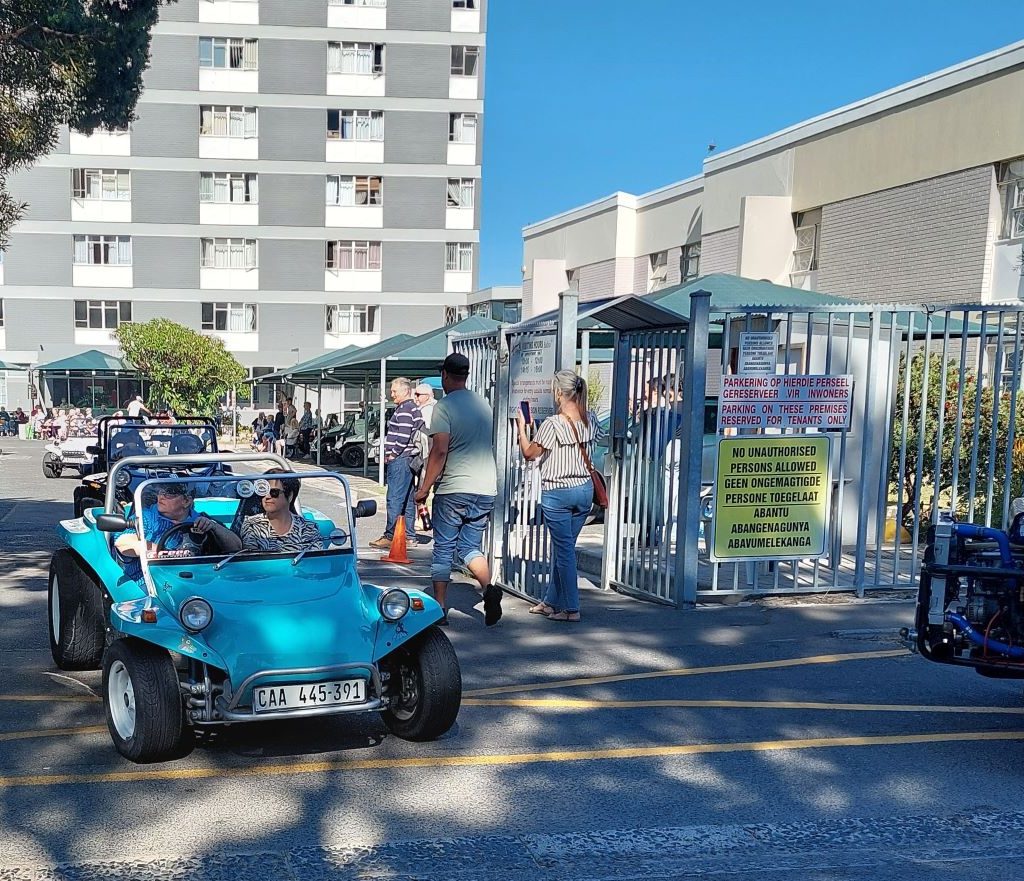 Merinda driving a senior resident in her custom beach buggy during The Wild Buggers Beach Buggy Club charity visit.
