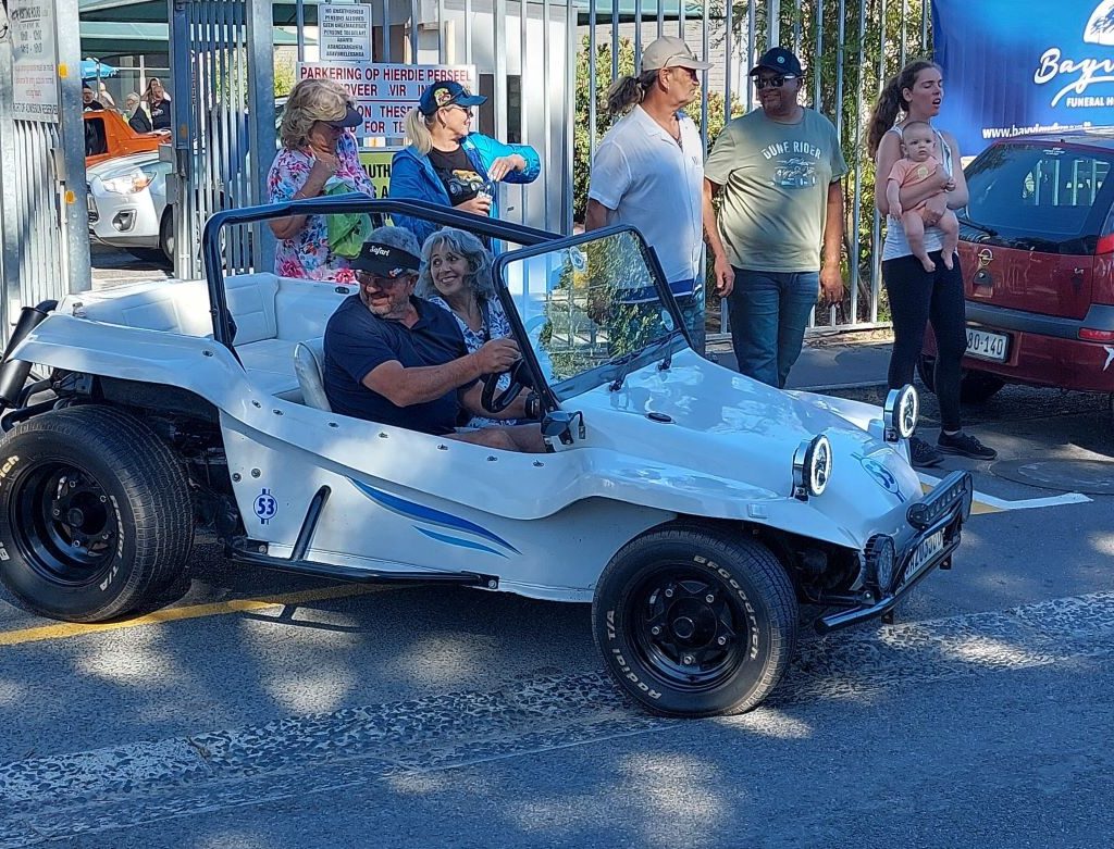 Nick driving a senior resident in his custom VW beach buggy during The Wild Buggers Beach Buggy Club charity event.