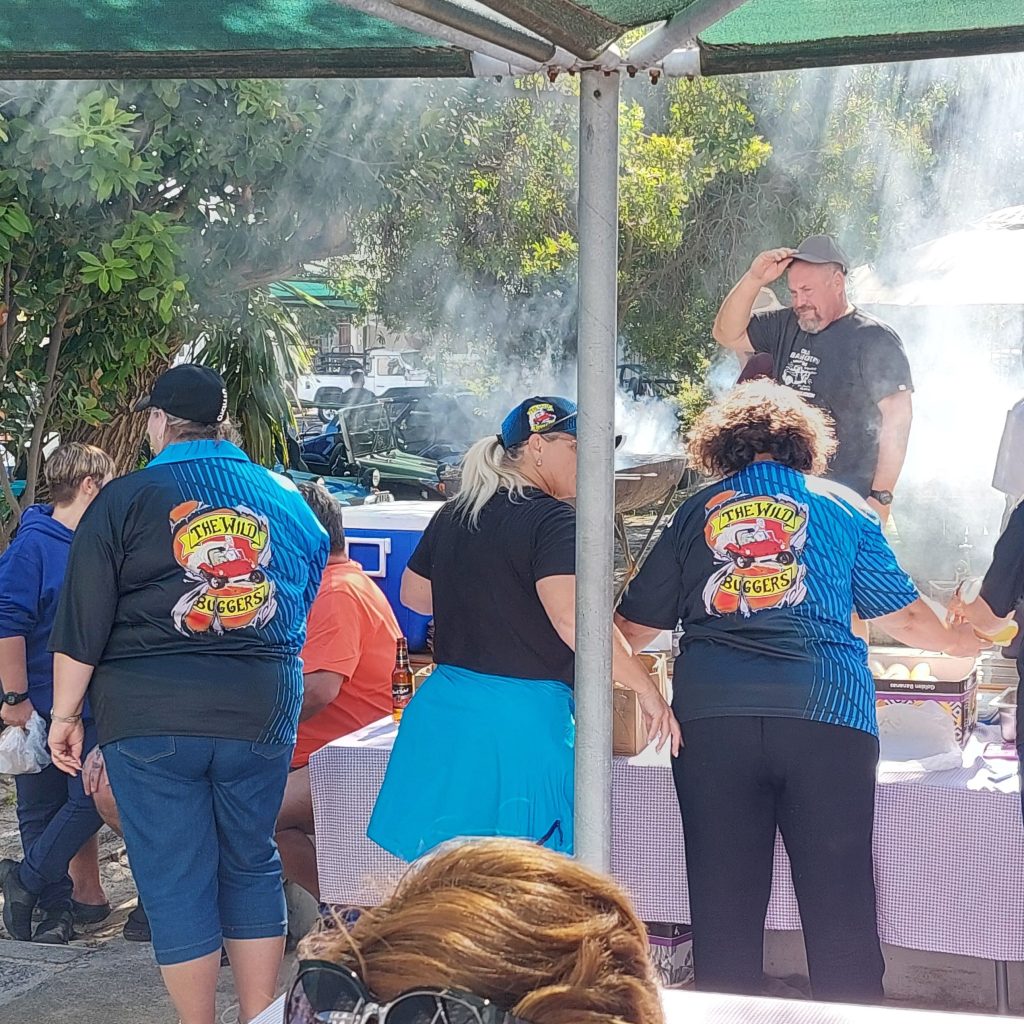 The Wild Buggers Beach Buggy Club members preparing and dishing up food for the seniors at Huis Uitsig.