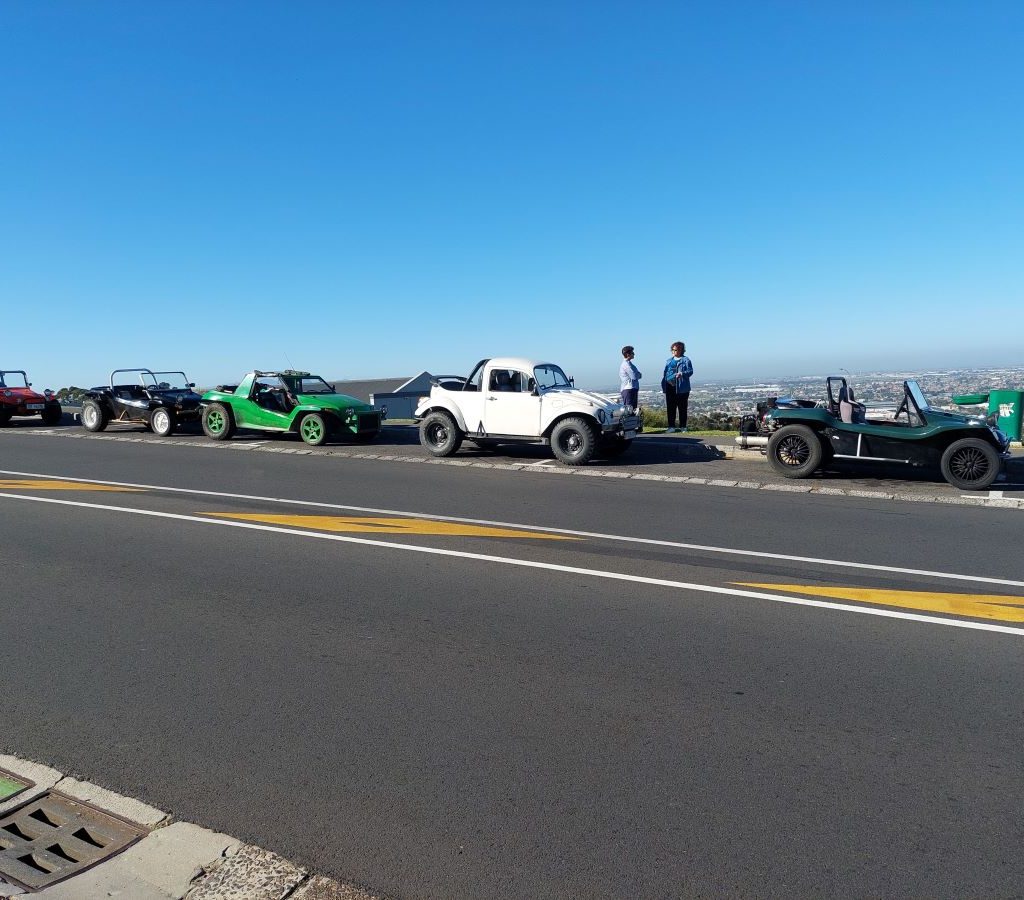 A line of classic Beach Buggies and VW air-cooled vehicles parked on Lovers Lane during the Wild Buggers Charity Run.