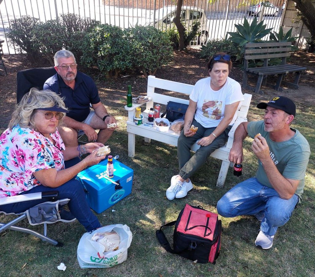 Members of The Wild Buggers Beach Buggy Club enjoying lunch and chatting together after the Huis Uitsig charity event.