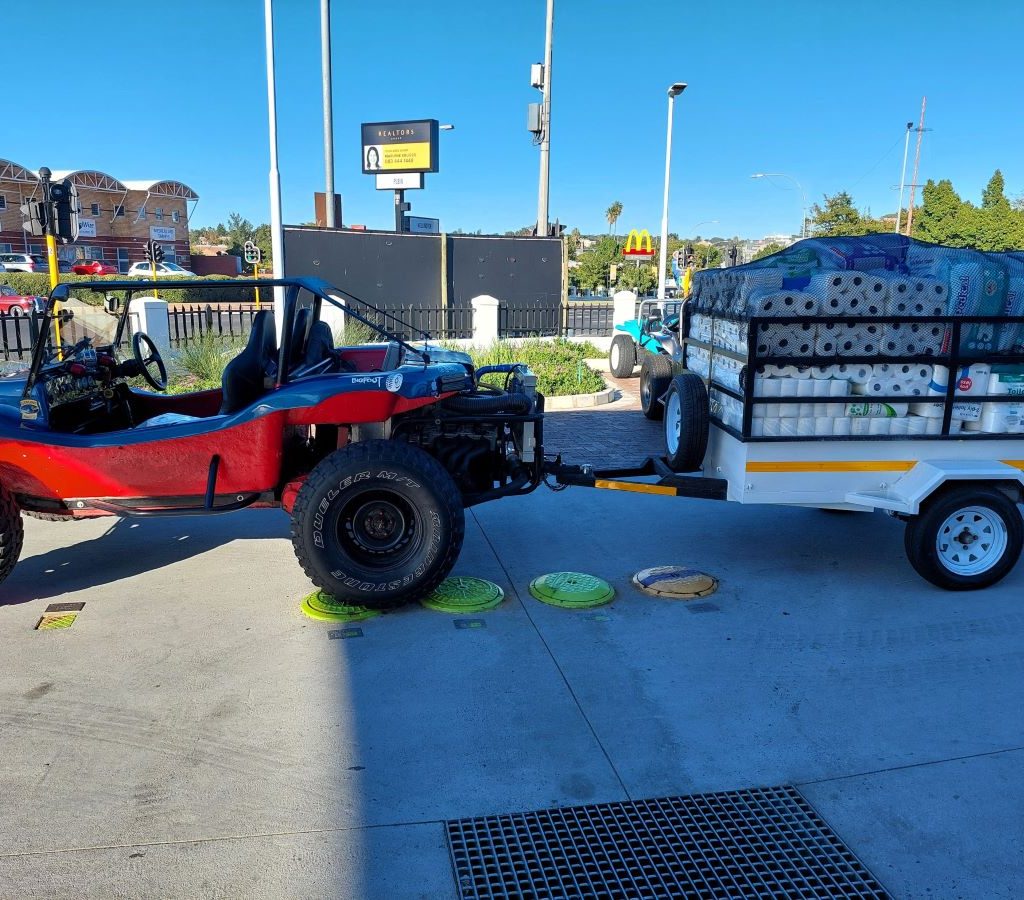 A trailer overflowing with donations from Wild Buggers Beach Buggy Club members at the Durbanville meeting point for Huis Uitsig.