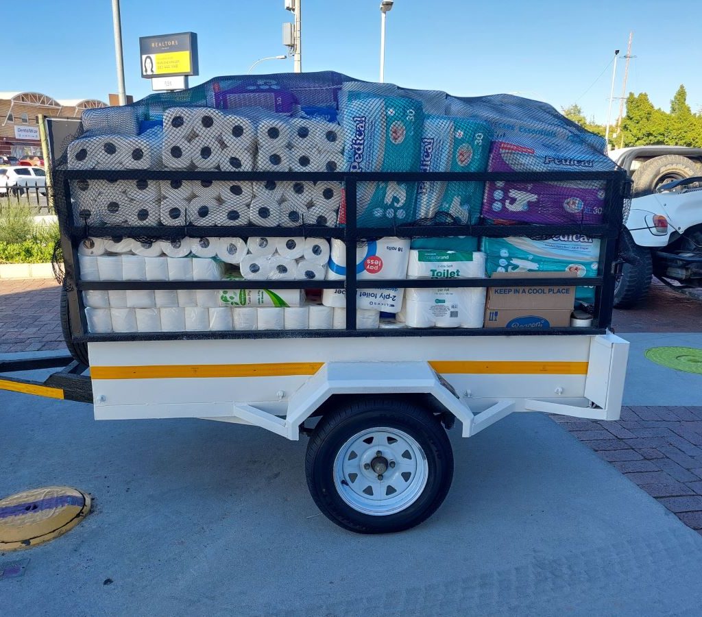 Close-up of the donation trailer filled with supplies from the Wild Buggers Beach Buggy Club for the Huis Uitsig Charity event.