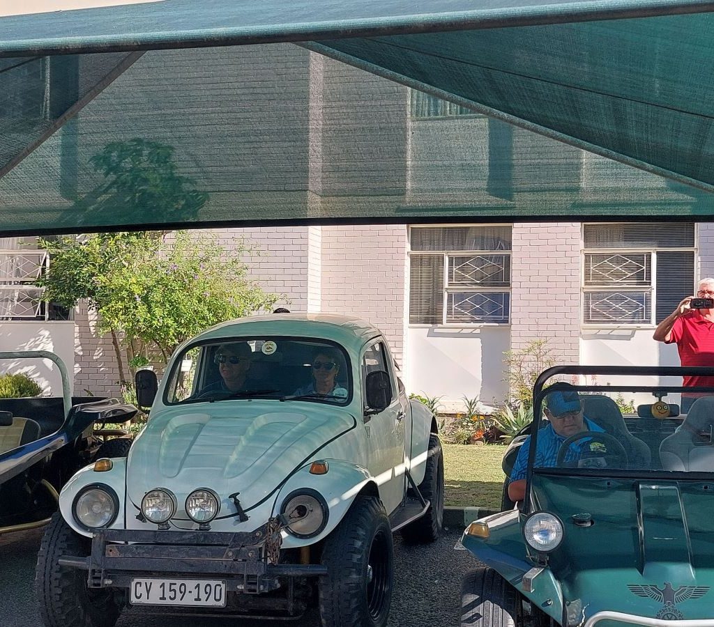 Andre Welsh’s white VW Baja Bug parked with the Wild Buggers Beach Buggy Club at Huis Uitsig for the charity run.