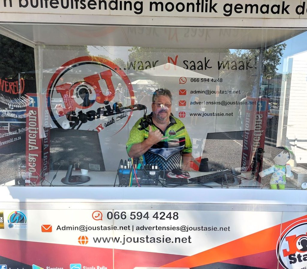 Gary Flemming, DJ of Jou Stasie, broadcasting live from the mobile studio trailer at the Wild Buggers Beach Buggy Club charity event.
