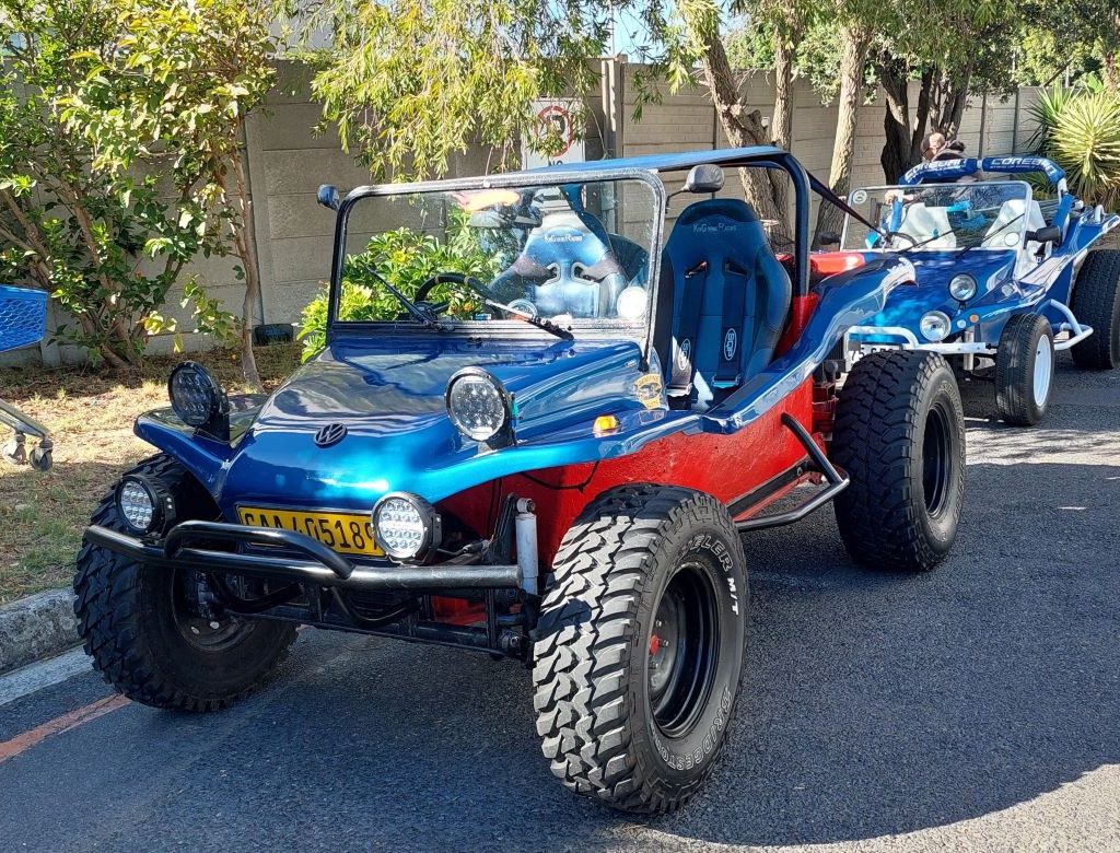 A custom blue Beamish Beach Buggy powered by a 2L VW Golf engine, showcased during a Wild Buggers club event.