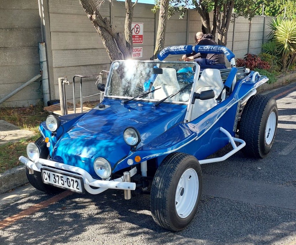A classic blue Beamish Beach Buggy featuring a 1600cc VW air-cooled engine at a Wild Buggers club event.