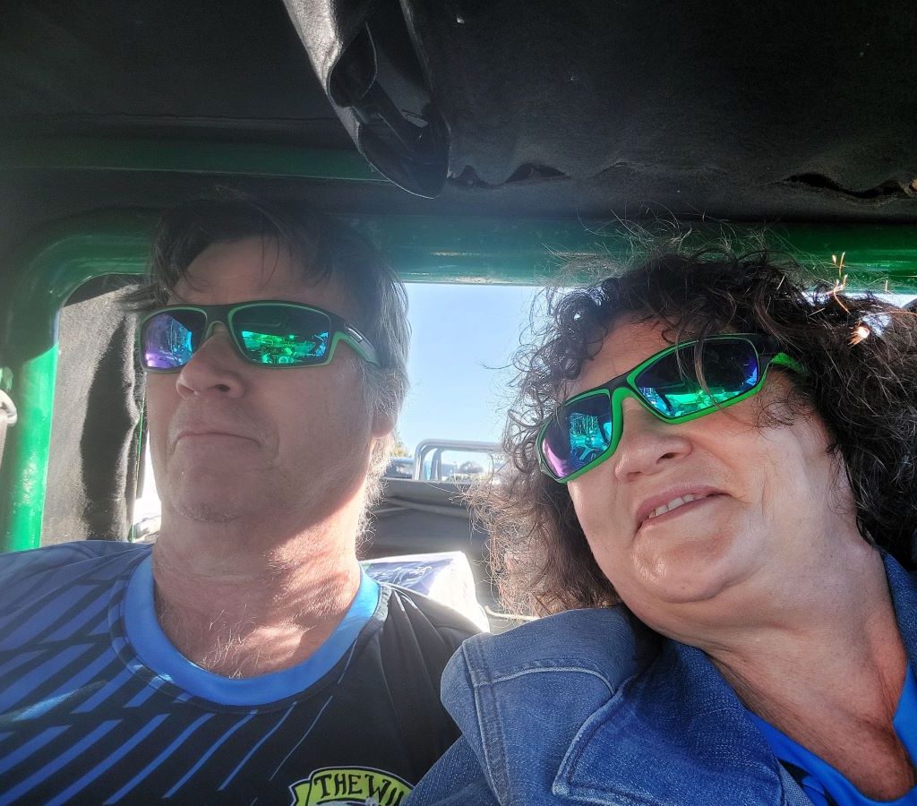 Wild Buggers Club President Anton Kleyn and Mickey taking a selfie while driving their green Kango Beach Buggy on the Huis Uitsig Charity Run.
