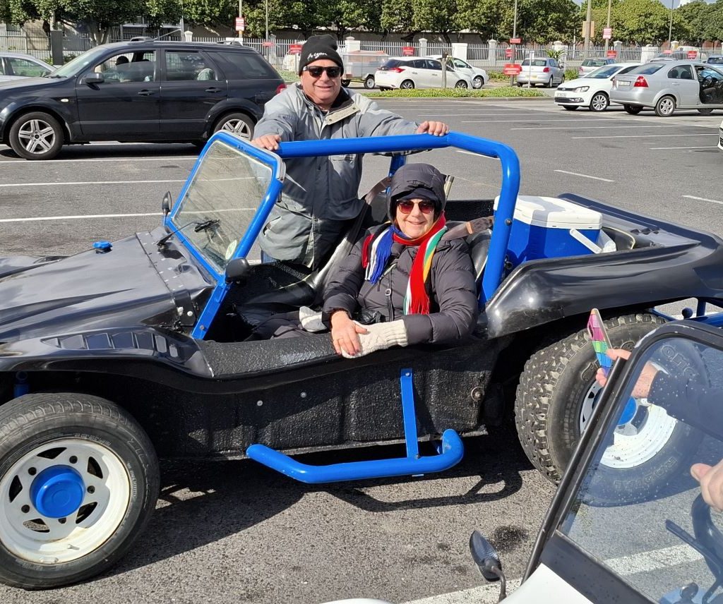 Clive and Linda, new members of the Wild Buggers Beach Buggy Club, in their black Beach Buggy.