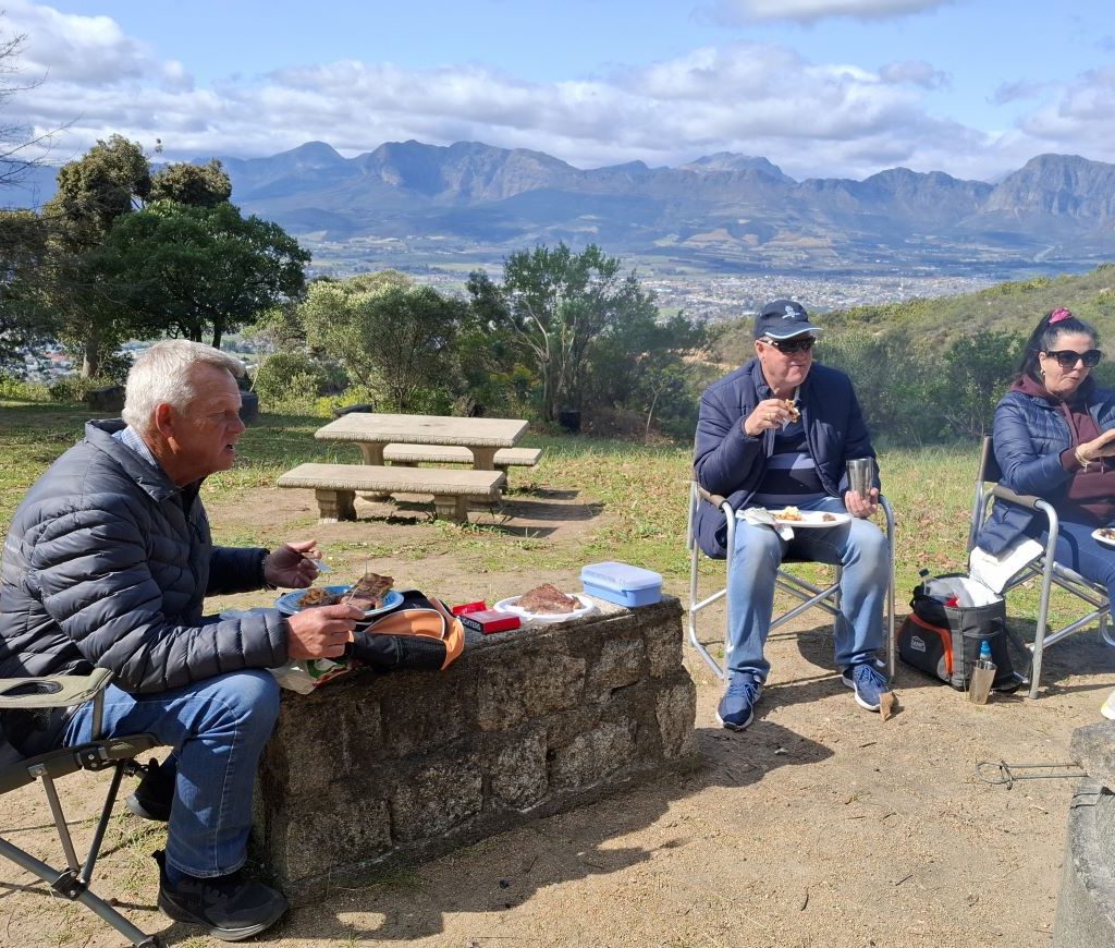 Mario, Theo, and Elna enjoying their meal at a Wild Buggers Beach Buggy Club event.