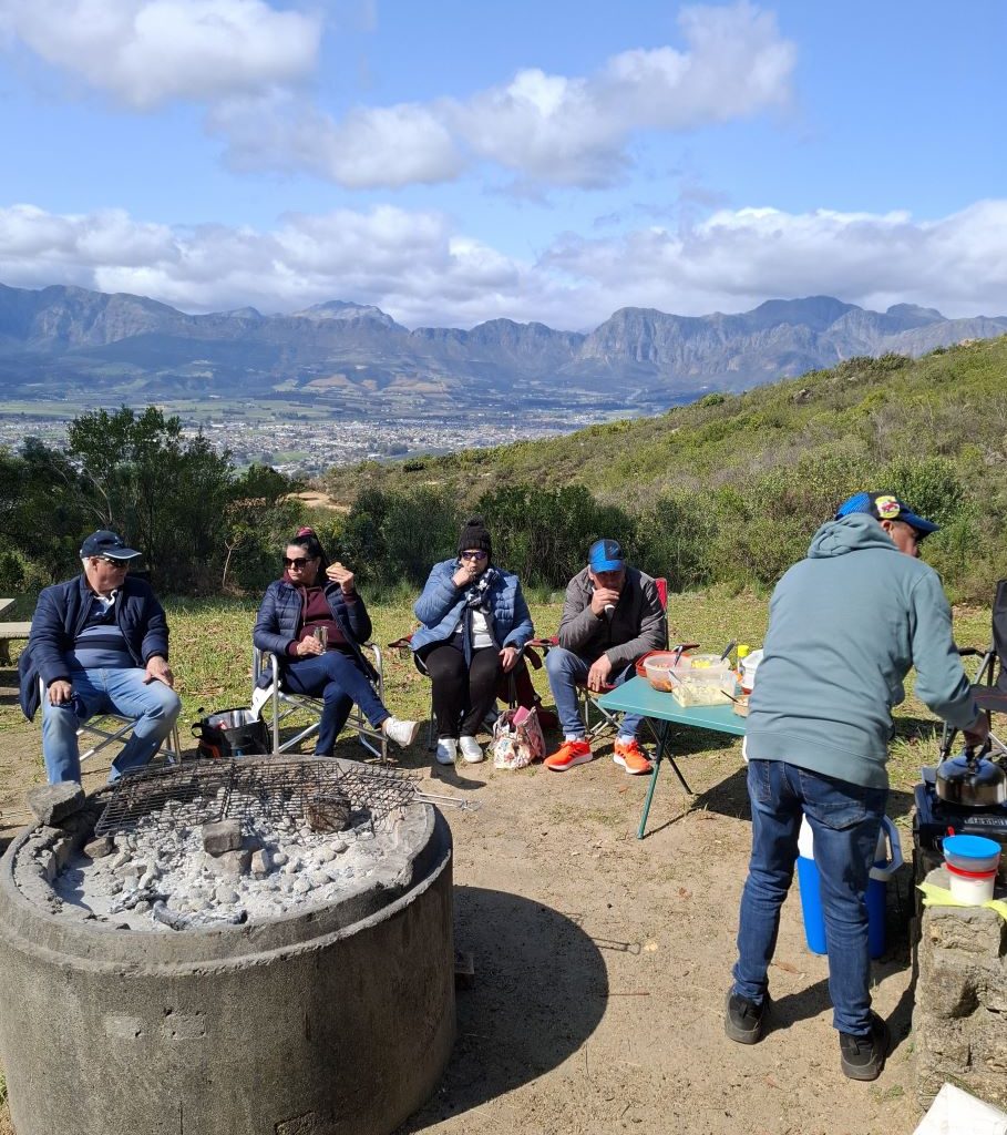Wild Buggers Beach Buggy Club members chatting after finishing their meal at a club event.