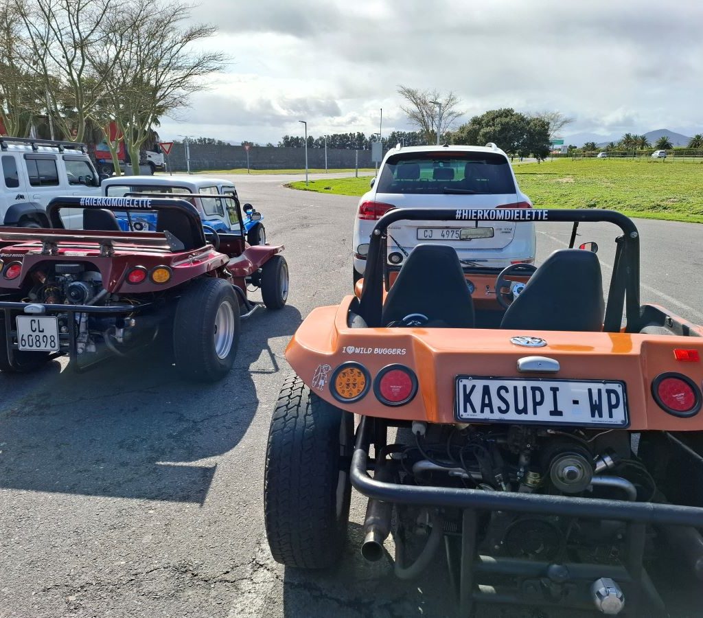 Solandra’s red Beamish beach buggy, Bad Boy, parked next to Landria’s orange Beamish buggy, Kasupi, at Engin 1 Stop.