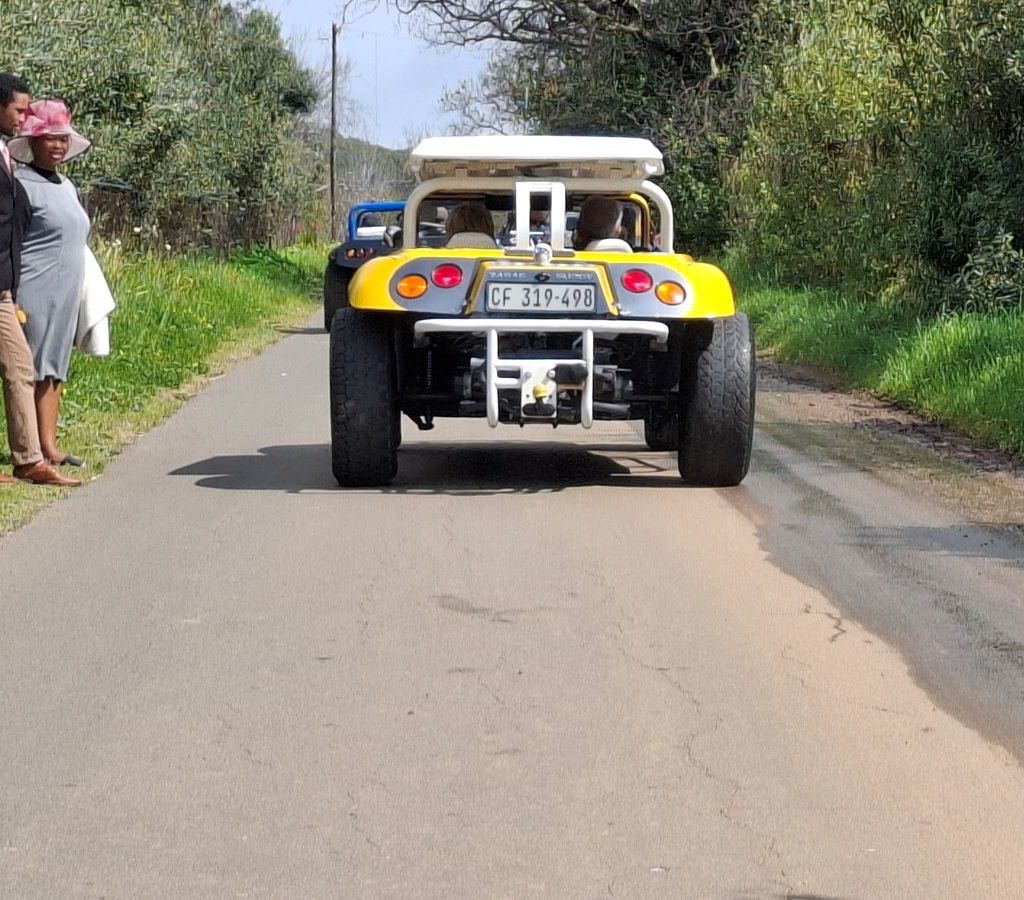 Close-up of Chris Zara’s yellow Salamander beach buggy on the gravel road in Paarl heading to the braai spot.