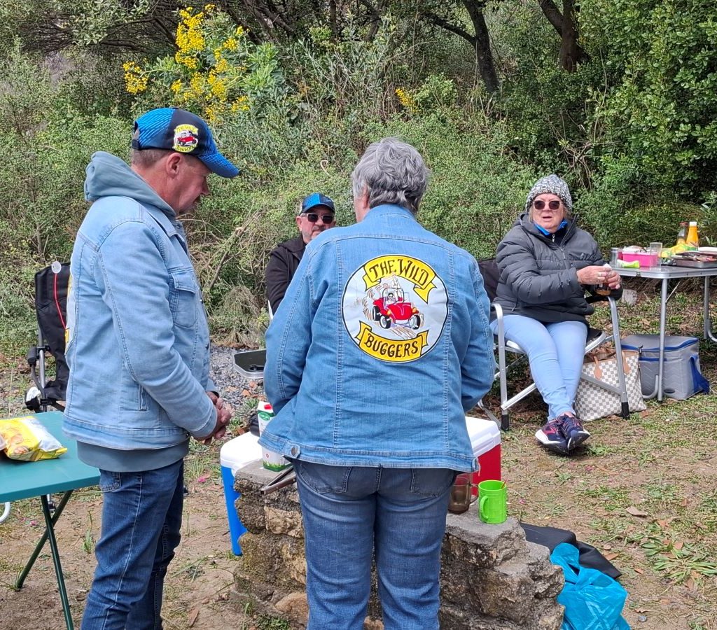 Wild Buggers Beach Buggy Club members chatting around the braai area during the Paarl Run.