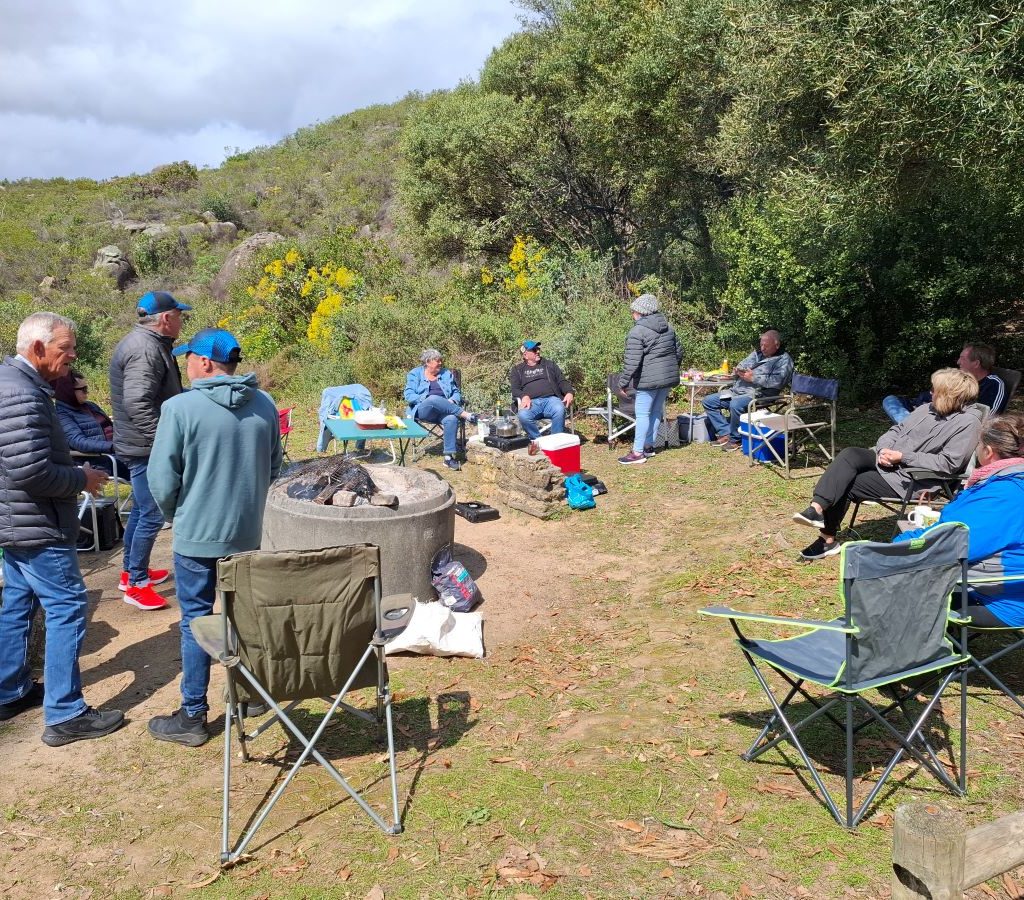 Wild Buggers Beach Buggy Club members relaxing at the braai area during a club event.