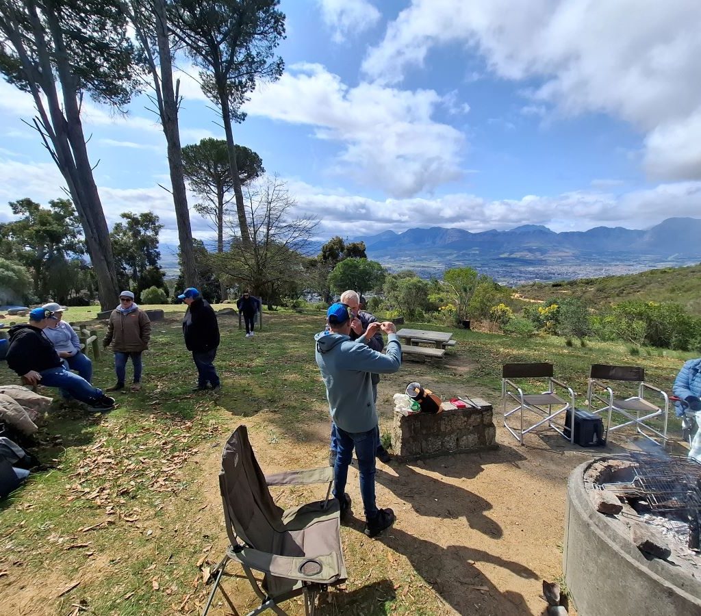 A scenic view of the landscape during a Wild Buggers Beach Buggy Club event, featuring mountains and greenery.