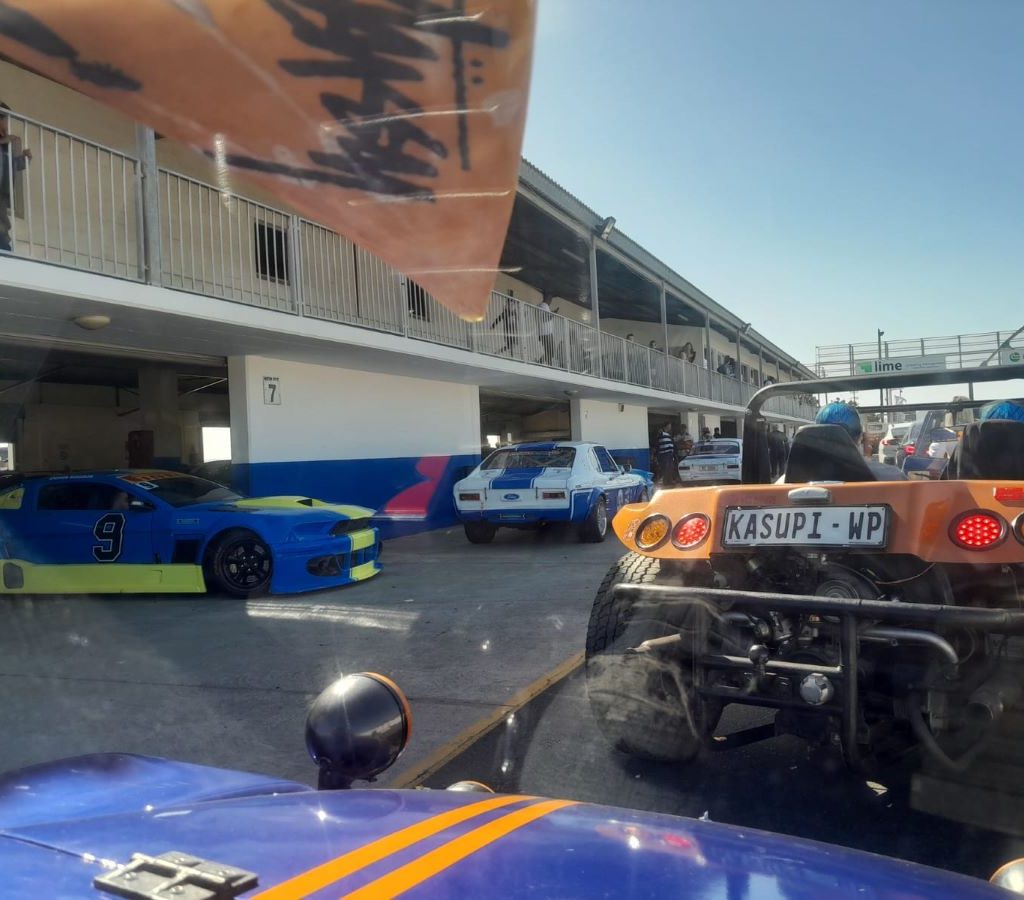 A Ford Mustang joining the Wild Buggers Beach Buggy Club on the Killarney race track, adding to the variety of vehicles at the event.