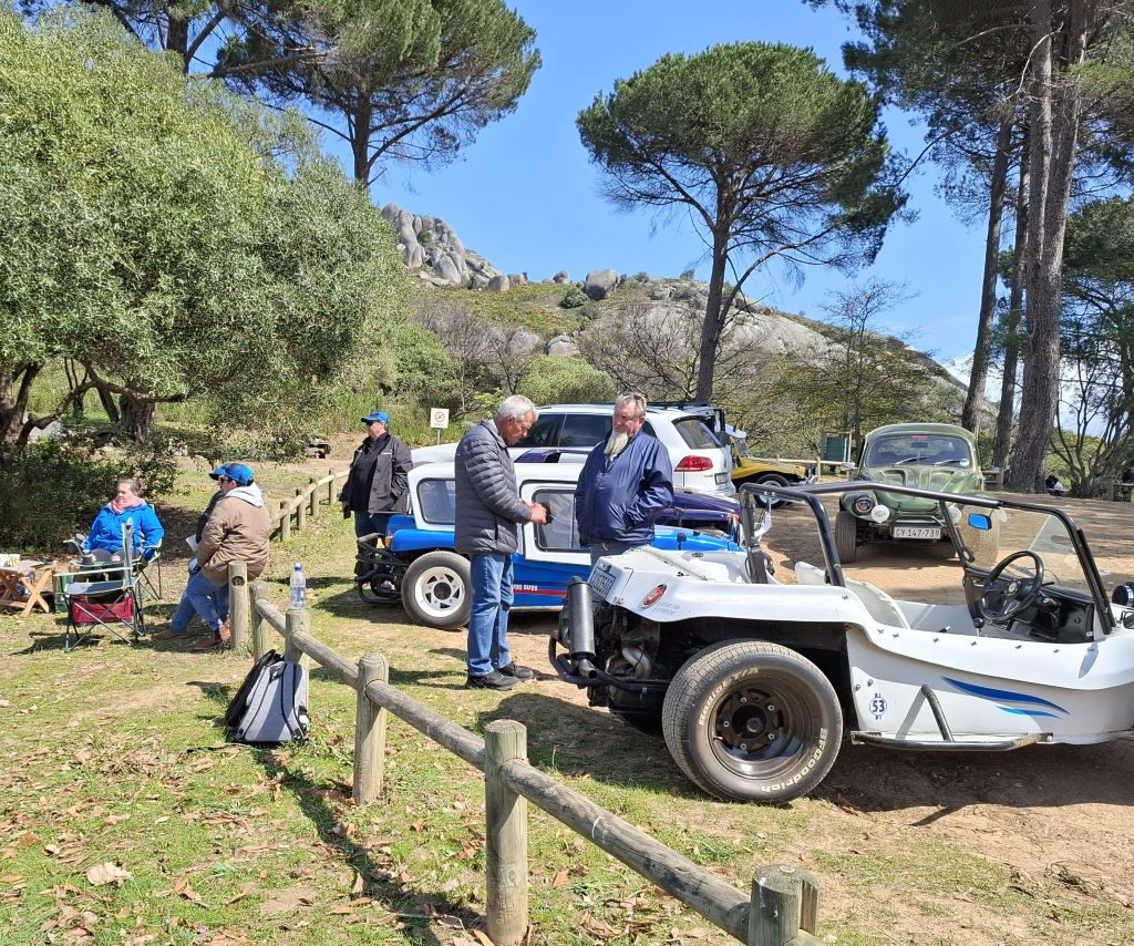 Wild Buggers Beach Buggy Club members chatting near their parked buggies during a club event.