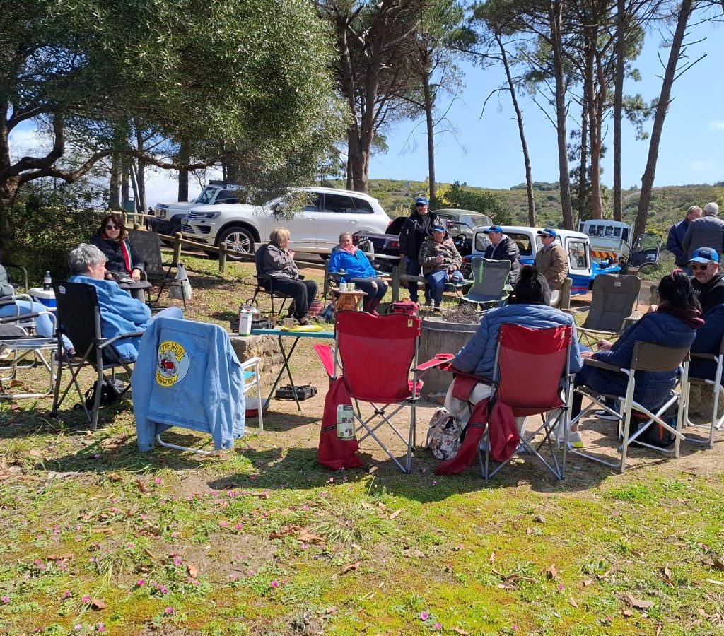 Wild Buggers Beach Buggy Club members sitting around and chatting during a club event.