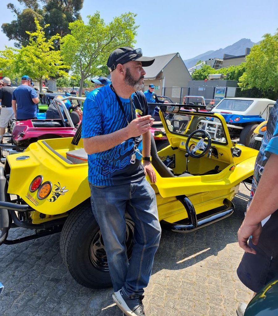 Wiehann Geldenhuys chatting next to Anthony's VW bug during the Wild Buggers Winelands Breakfast Run.