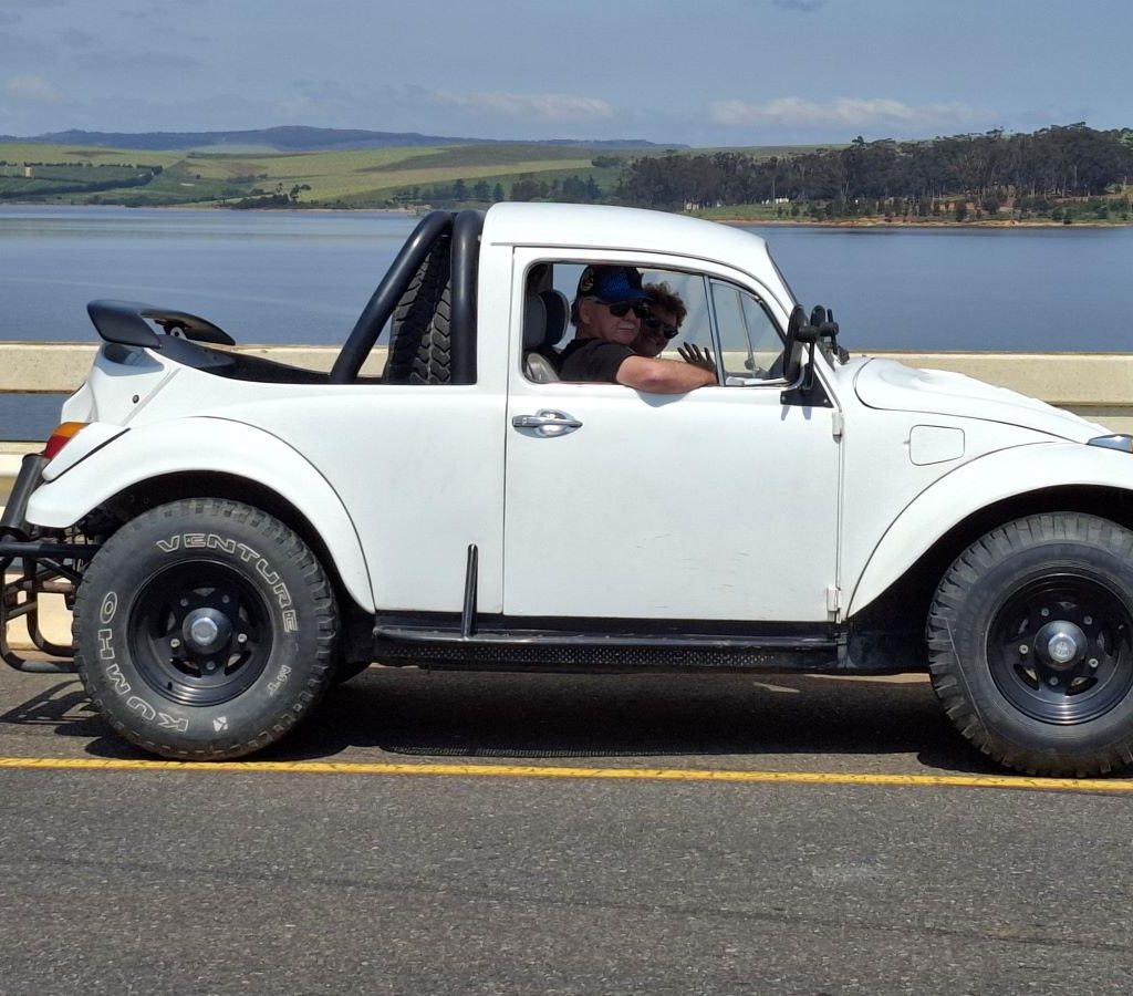 Andre and Karen driving their white Baja Bug bakkie during the Wild Buggers Winelands Breakfast Run.