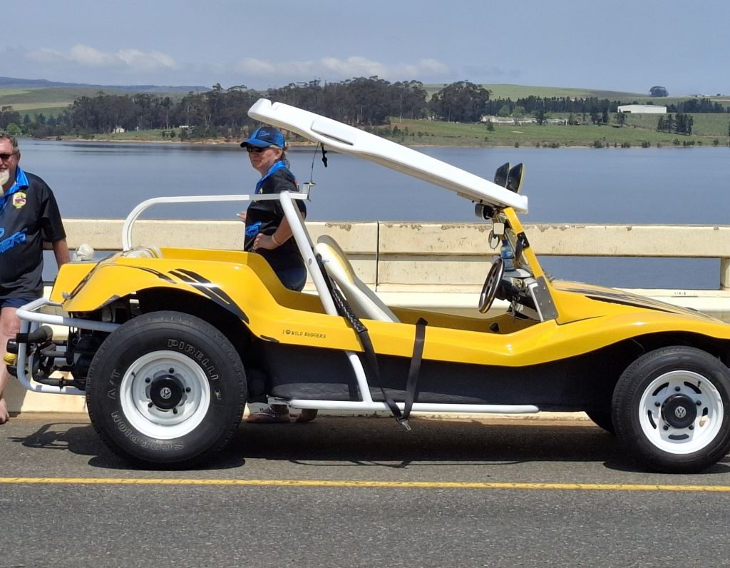 Chris and Sandra Zara standing by their yellow Salamander beach buggy, Zara’s Bug, during the Wild Buggers Winelands Breakfast Run.