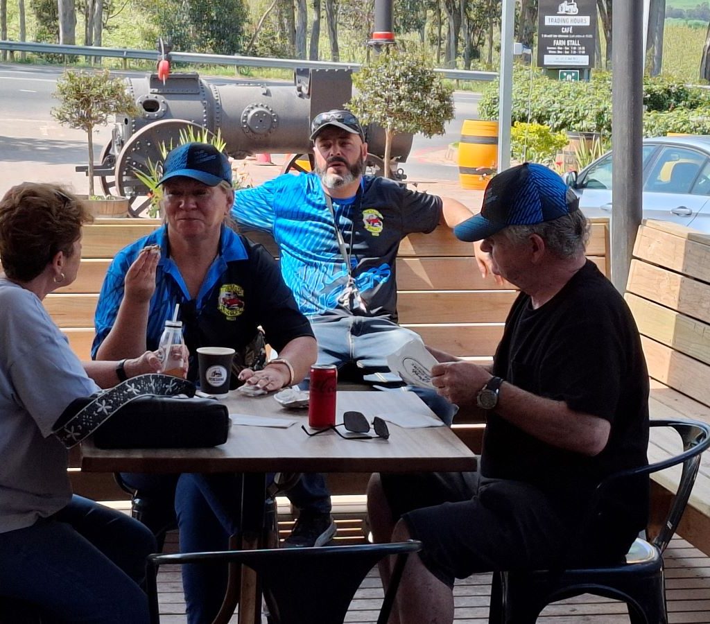 Wild Buggers members gathered and chatting at Peregrine Farm Stall in Grabouw during the Winelands Breakfast Run.