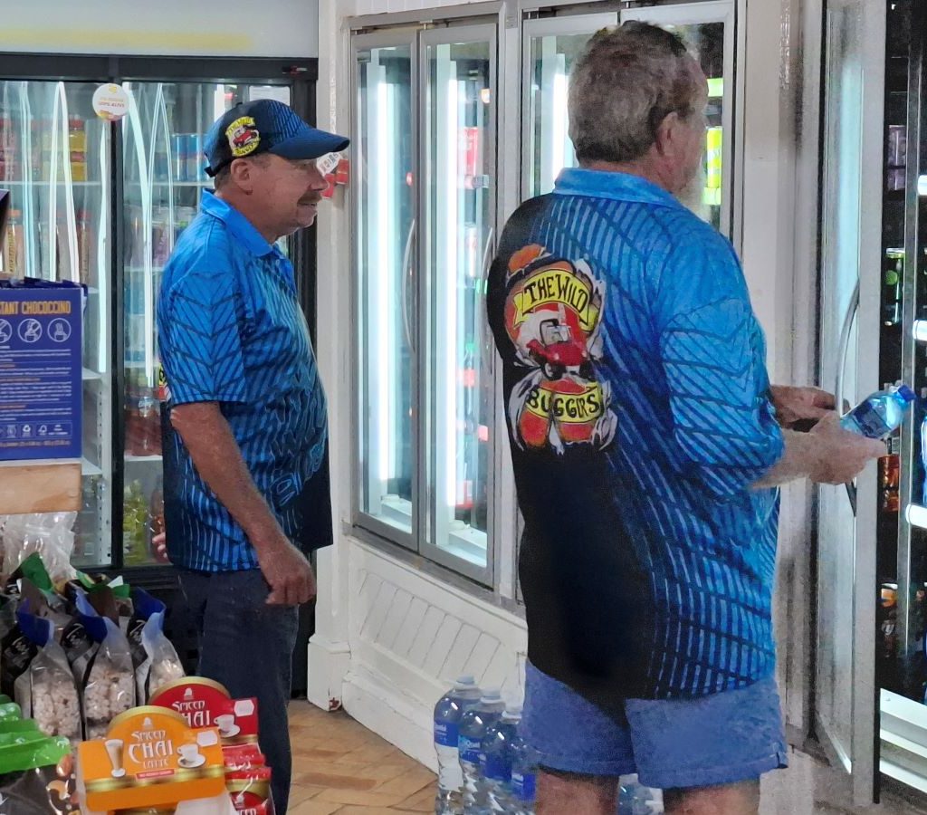 Wild Buggers members enjoying refreshing drinks at the Orchard near Grabouw during the Christmas Run 2024, quenching their thirst after a scenic drive.