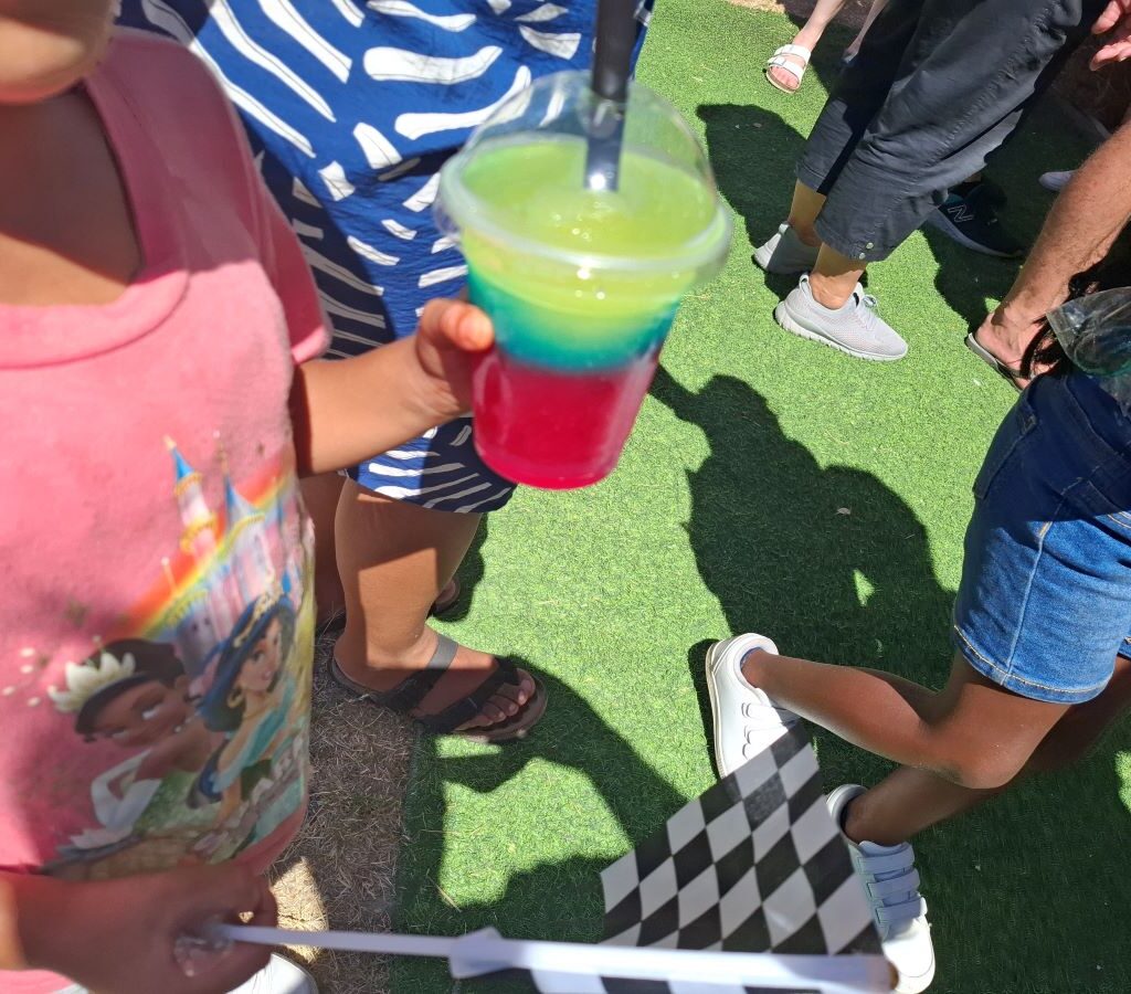 Rhoodie Ackerman and Rico Barlow serving slush puppies to children at the Wild Buggers Beach Buggy Club's Killarney International Raceway charity run.