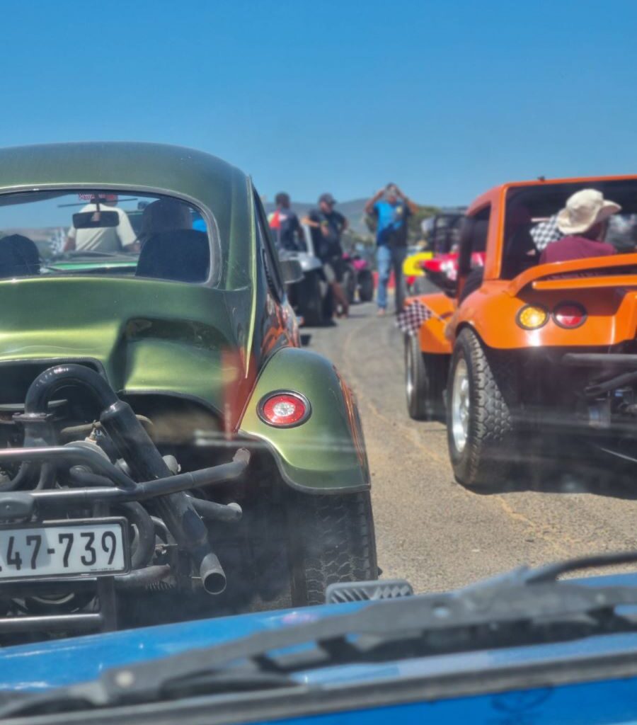 Wild Buggers beach buggies lined up and ready to drive the track at the Killarney International Raceway charity run, with members eagerly awaiting the start.