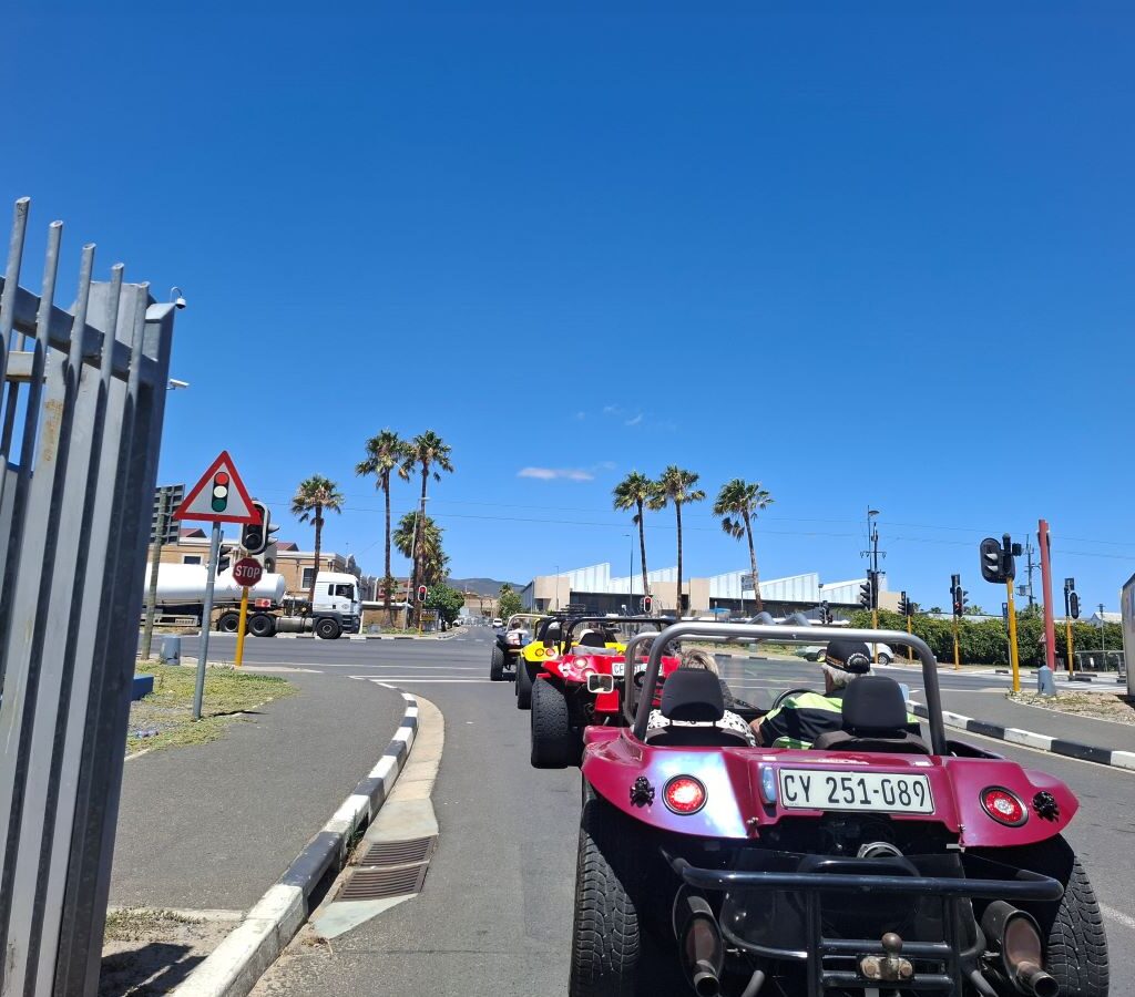 Four Wild Buggers beach buggies on the road after a pre-run organization trip for their Killarney International Raceway charity event, heading for ice cream in Melkbosstrand.