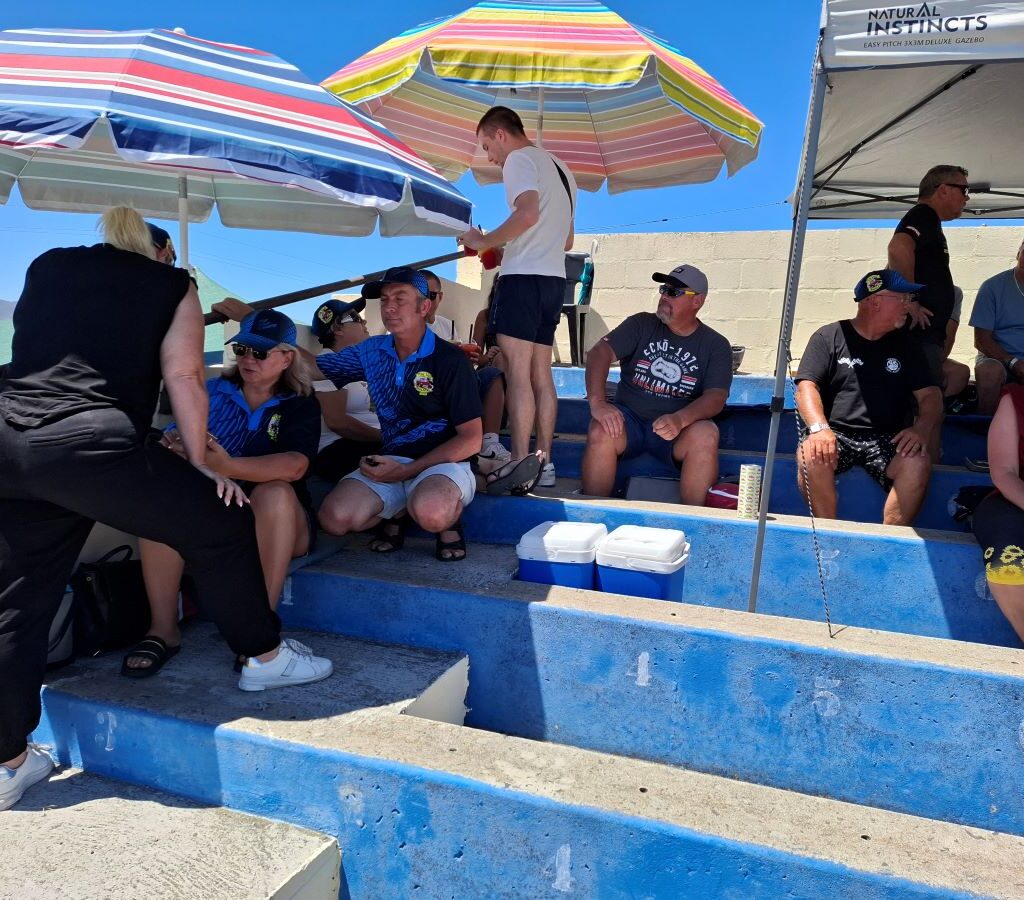 Wild Buggers Beach Buggy Club members waiting on pre-arranged grandstand seats at Killarney International Raceway for children arriving from four orphanages for their charity run.