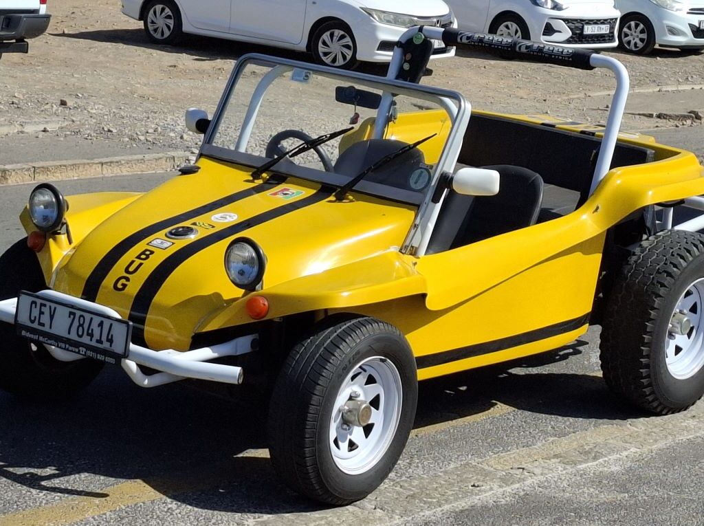 Wiehann Geldenhuys' yellow Beamish beach buggy, "Bug," with its 1600 VW air-cooled Beetle motor, at Surfers Corner during the Wild Buggers Valentine's Day run.
