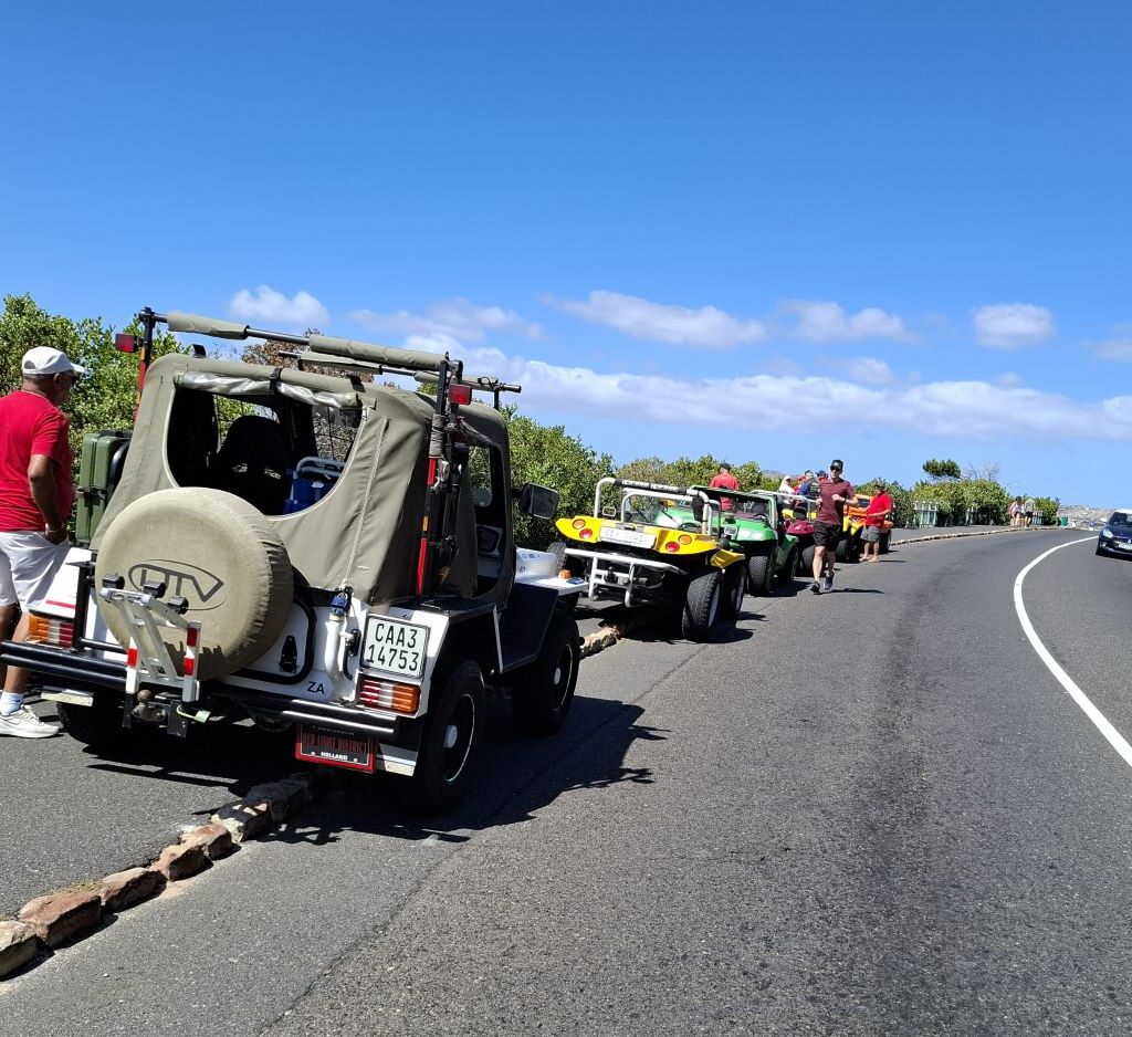 The Wild Buggers Beach Buggy Club members stop at the shark watchers lookout for a scenic break during their Valentine's Day run. Classic VWs and stunning views.