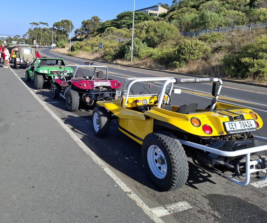 A different perspective on Anton Kleyn's "Shrek" (green Kango), Garry Fleming's "Emoji" (pink Beamish), and Wiehann's yellow Beamish beach buggies at the Wild Buggers Valentine's Run.