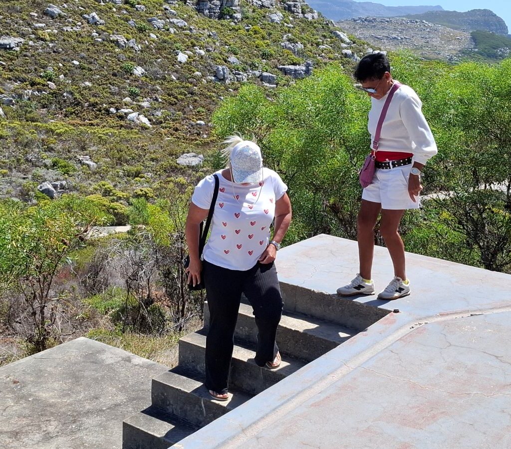 Michelle and Ayesha carefully navigating the stairs down from The Cannon in Simonstown during the Wild Buggers Beach Buggy Club's Valentine's Day run.