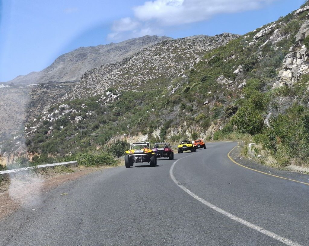 Wild Buggers Beach Buggy Club members on the road again, driving up a mountain road and following Brent, Anthony, Gary, and Wiehann's beach buggies during their Valentine's Day run. Classic VWs conquering the climb.