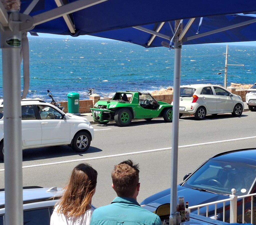 Anton Kleyn's green Kango beach buggy, "Shrek," parked next to the ocean. Photo taken from Dixie's Restaurant during the Wild Buggers Beach Buggy Club's Valentine's Day run.