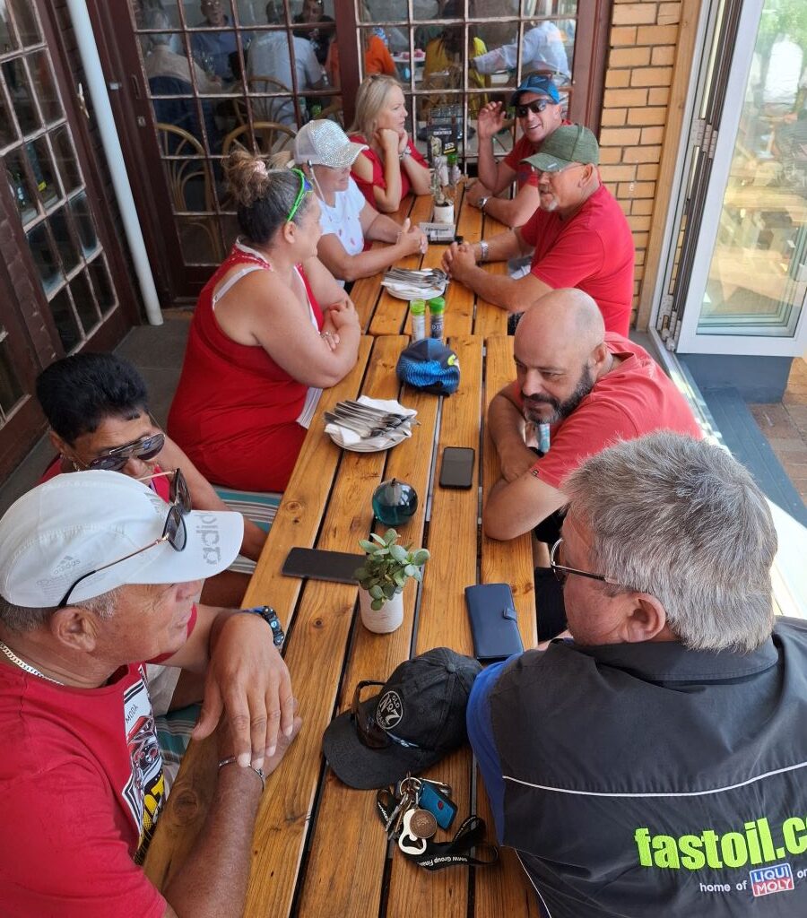 Wild Buggers Beach Buggy Club members at Dixie's Restaurant, waiting for lunch during their Valentine's Day run. Classic VWs likely parked outside.