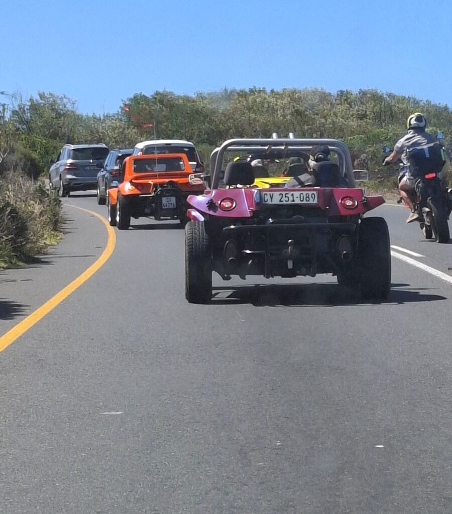 Wild Buggers Beach Buggy Club members on the road again during their Valentine's Day run, heading to more destinations. Classic VWs in motion.