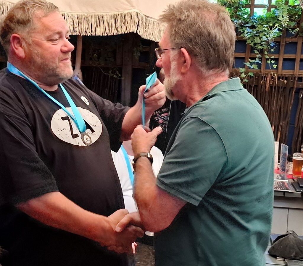 James Taylor proudly showing off his Cape Buggy Tour 2025 medal, adding another achievement to his collection!