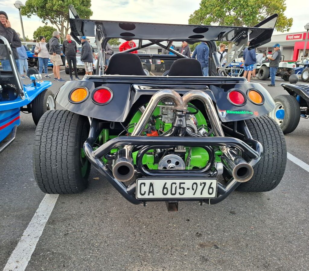 A sleek black Beamish beach buggy parked at the Reach for a Dream charity run, shining under the sun with bold styling and polished detail.