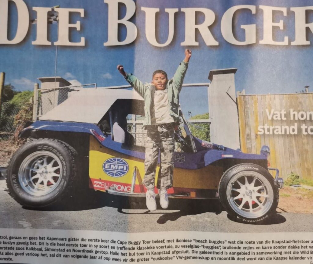 The Cape Buggy Tour 2025 featured on the front page of Die Burger, highlighting the exciting event and the wild beach buggies on the road.