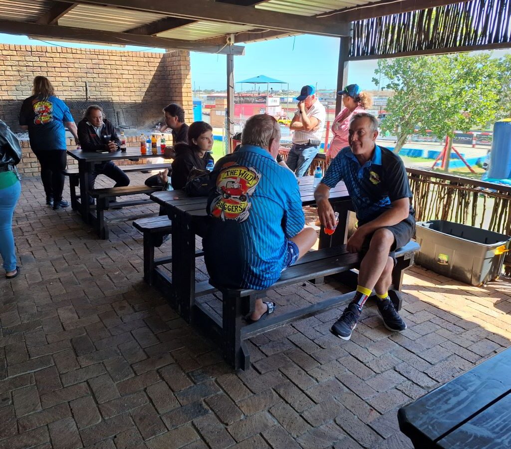 A photo of Wild Buggers Beach Buggy Club members relaxing after the successful Reach for a Dream charity run.