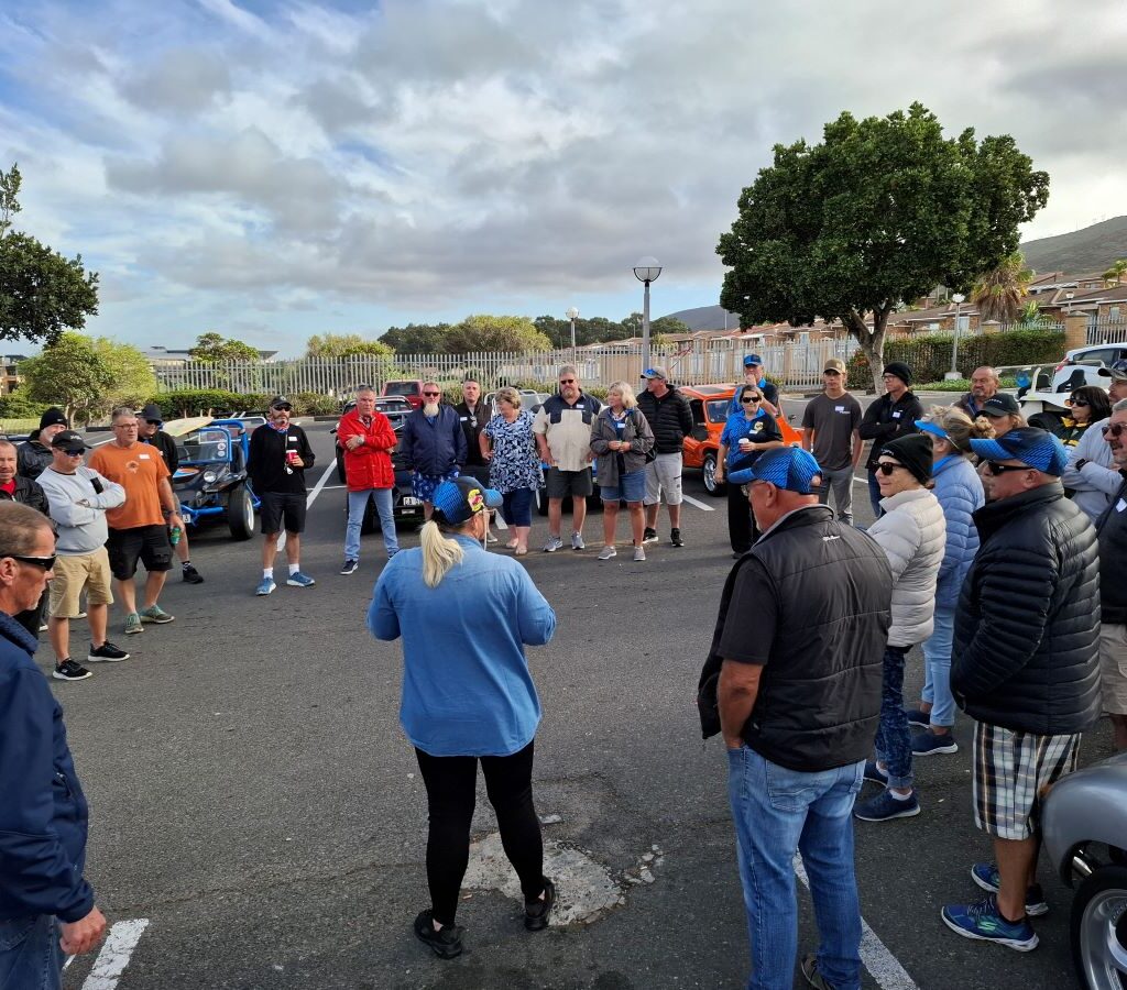 Michelle Jenkins, the charity run organizer, addressing Wild Buggers Beach Buggy Club members during a morning briefing at the Reach for a Dream event.