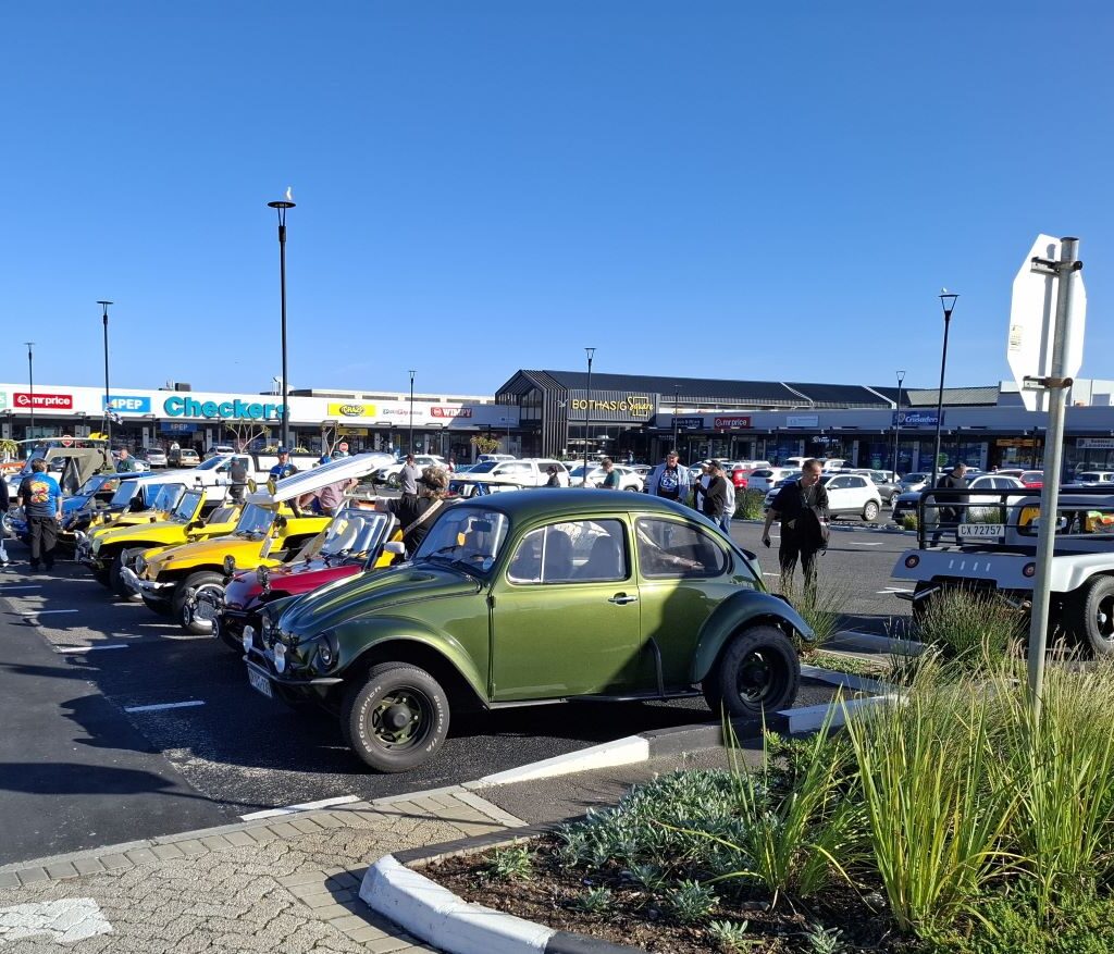 A convoy of classic beach buggies lined up and ready to start the Cape Buggy Tour 2025, engines revving and excitement building.